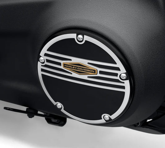 Silver circle derby cover with black detailed and gold Harley-Davidson logo